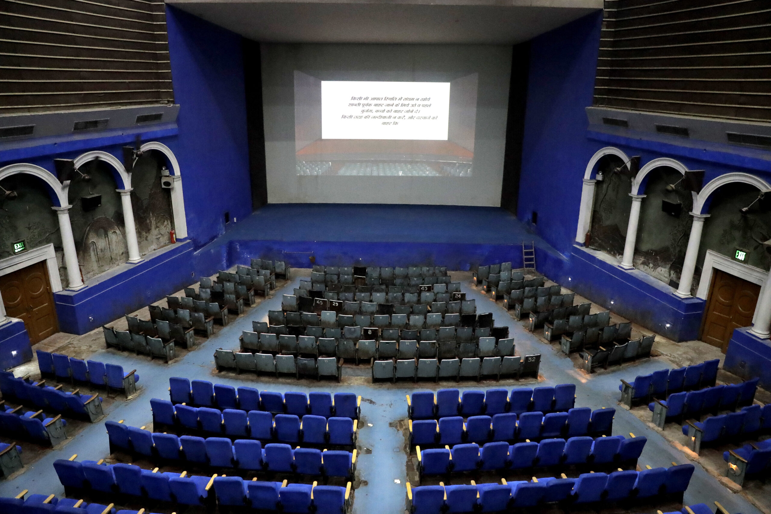 This Thursday, March 30, 2017 photo shows an overview of the colonial era Regal Theater in New Delhi, India. The Indian capital's iconic theater signed off on Thursday night after more than eight decades with nearly 600 movie buffs cheering a 1964 Bollywood classic at a final screening. It's expected to make way for a multiplex from a single screen. () (AP Photo/Manish Swarup)