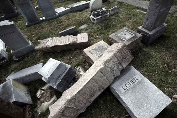 Damaged headstones in Jewish cemetery (AP Photo/Jacqueline Larma)