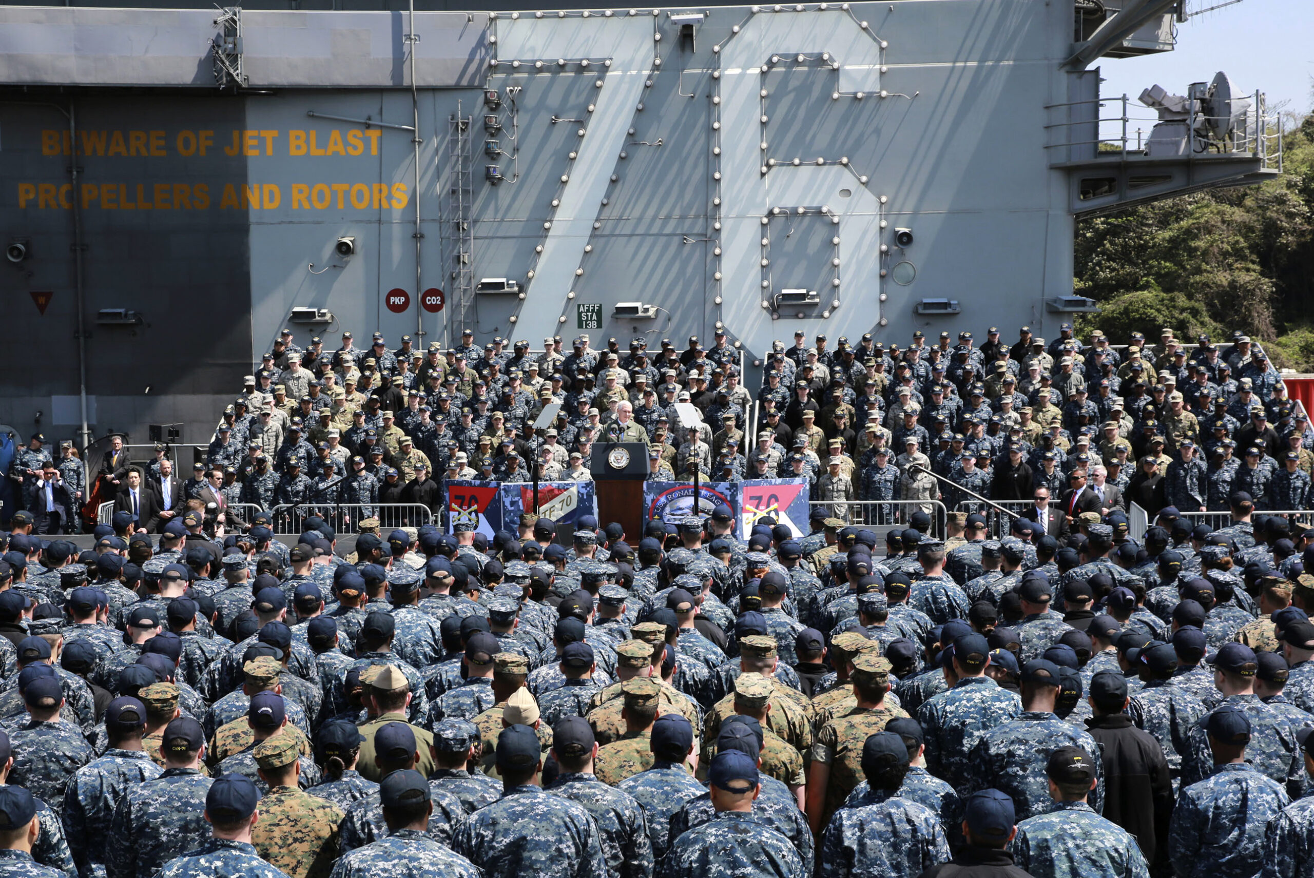 U.S. Vice President Mike Pence, center, speaks to U.S. servicemen and Japanese Self-Defense Forces personnel on the flight deck of U.S. navy nuclear-powered aircraft carrier USS Ronald Reagan, at the U.S. Navy's Yokosuka base in Yokosuka, south of Tokyo, Wednesday, April 19, 2017. (AP Photo/Eugene Hoshiko) (AP)