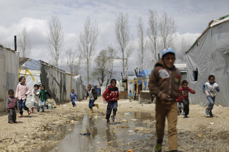 Syrian refugee children run at an informal refugee camp, at Al-Marj town in Bekaa valley, east Lebanon Lebanon, Saturday, April 8, 2017. For the millions of Syrian refugees scattered across camps and illegal settlements across the region, the chemical attack on a town in northern Syria and subsequent U.S. strike was a rare moment when the world briefly turned its attention to Syria, before turning away again.(AP Photo/Hassan Ammar) (AP)