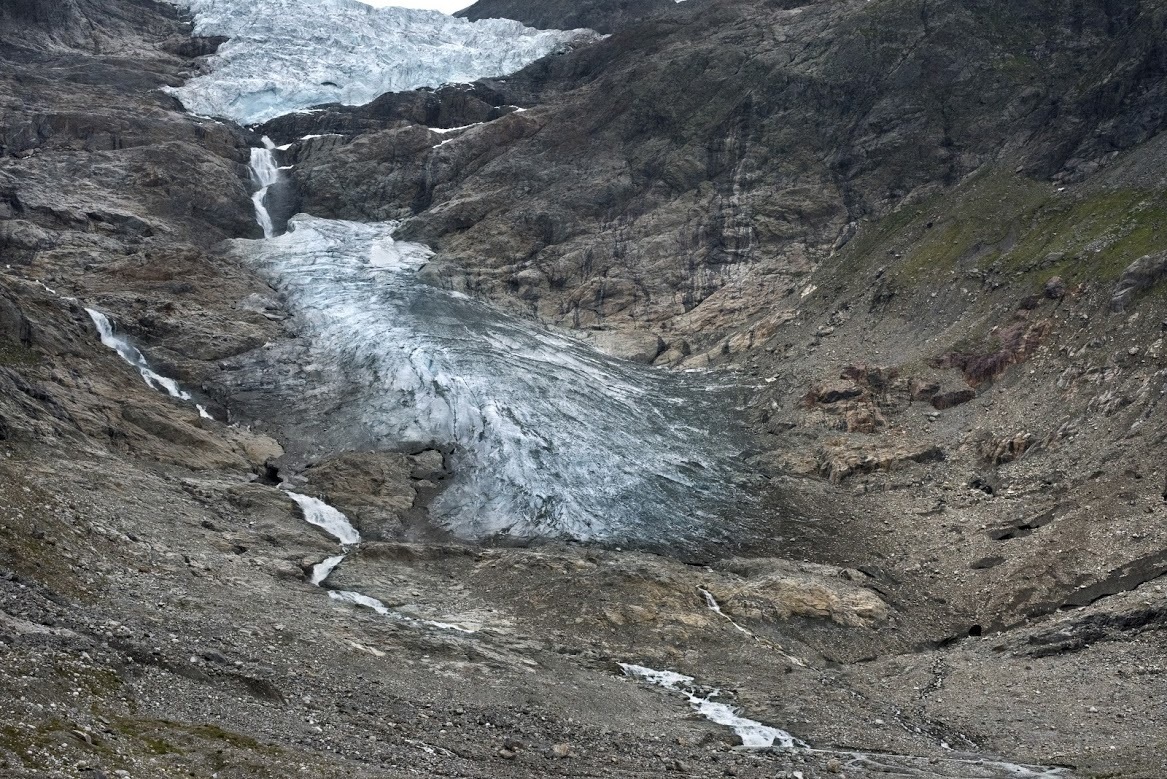 In this photo provided by James Balog/Extreme Ice Survey and Matthew Kennedy, the Trift glacier in Switzerland in 2015. Over the past decade or so scientists and photographers keep returning to the world’s glaciers, watching them shrink with each visit. Now they want other people to see what haunts them in a series of before and after photos. (Matthew Kennedy/Earth Vision Institute via AP)