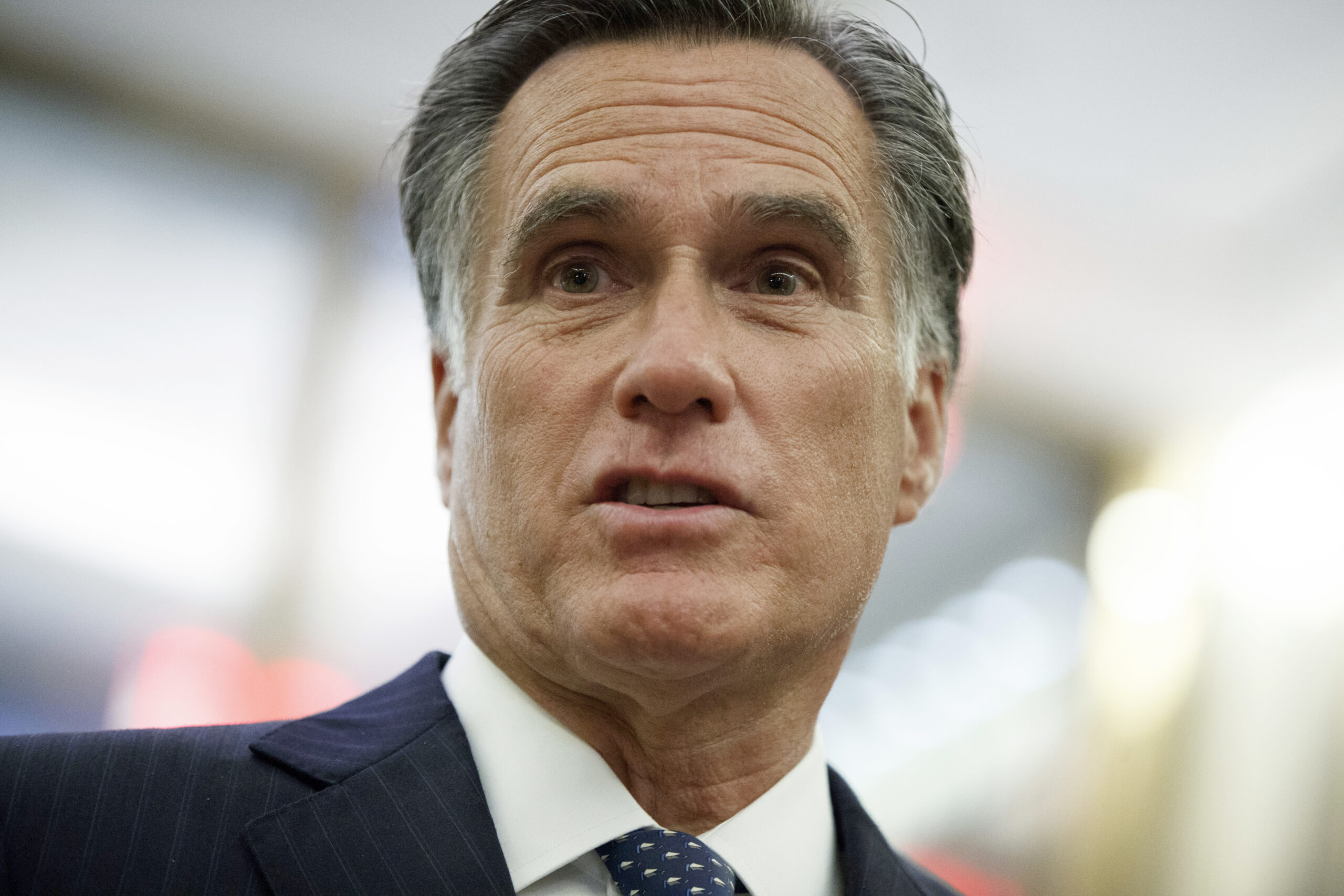 FILE - In a Tuesday, Nov. 29, 2016 file photo, former Republican presidential nominee Mitt Romney talks with reporters after eating dinner with President-elect Donald Trump at Jean-Georges restaurant, in New York. Romney’s “binders full of women” are actual binders after all _ filled with the resumes of women who hoped to land jobs in his administration as governor. The Boston Globe reports Tuesday, April 11, 2017, that it was shown the binders by a former Romney aide. The two white three-ring binders contain about 200 cover letters and resumes with some handwritten notes. (AP Photo/Evan Vucci, File) (AP)