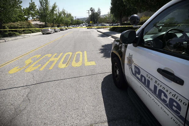 A police car is seen outside North Park School after a shooting, April 10, 2017, in San Bernardino, Calif. (AP/Ringo H.W. Chiu)
