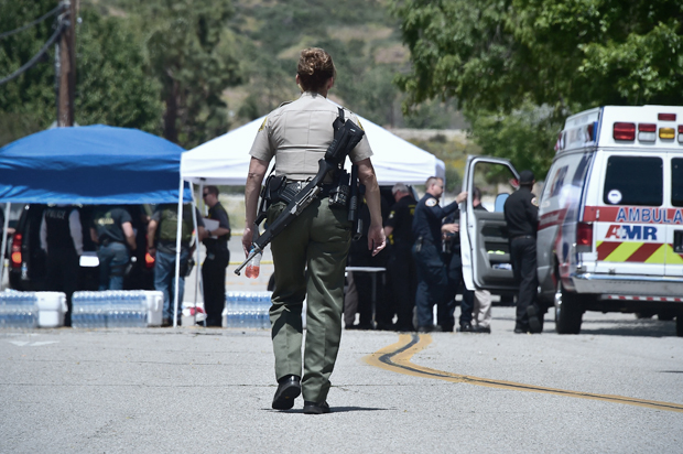 An armed law enforcement personnel in San Bernardino, California on April 10, 2017, following a school shooting. (Getty/Frederic J. Brown)