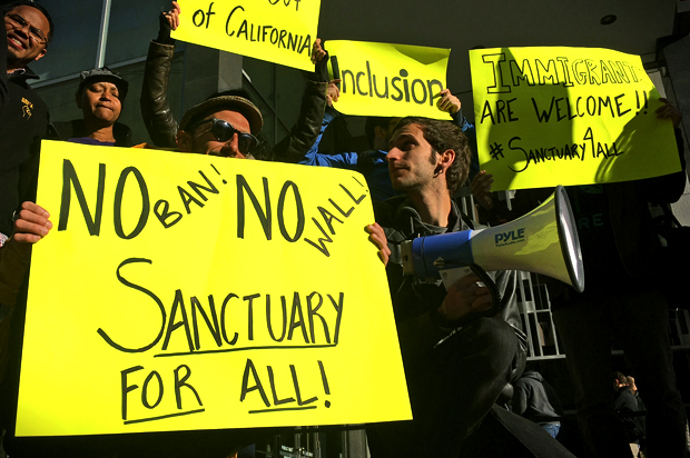 Protesters against sanctuary city crackdown (AP Photo/Haven Daley)
