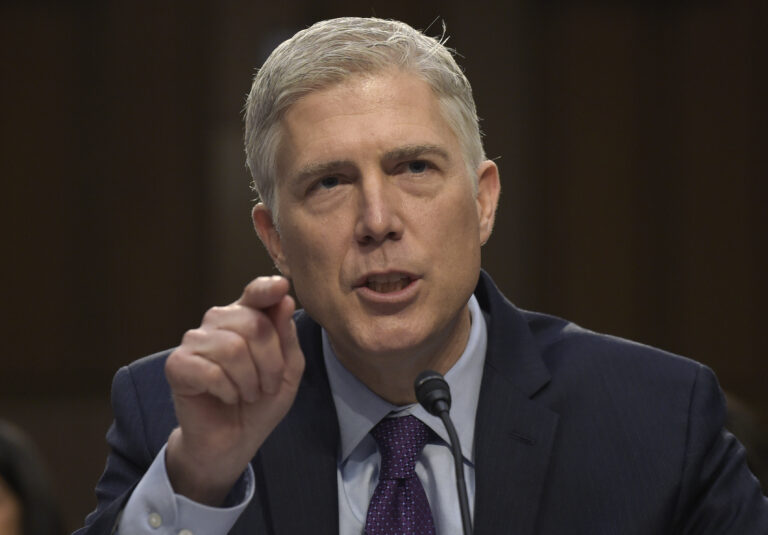 FILE - In this March 21, 2017 file photo, Supreme Court Justice nominee Neil Gorsuch testifies on Capitol Hill in Washington during his confirmation hearing before the Senate Judiciary Committee. A divided Senate Judiciary Committee backed Gorsuch, Monday, April 3, 2017. (AP Photo/Susan Walsh, File)