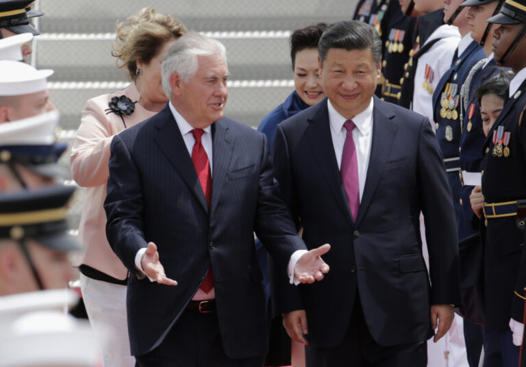 In this April 6, 2017, photo, Secretary of State Rex Tillerson, left, walks with Chinese president Xi Jinping at the Palm Beach International Airport in West Palm Beach, Fla. (AP Photo/Lynne Sladky)