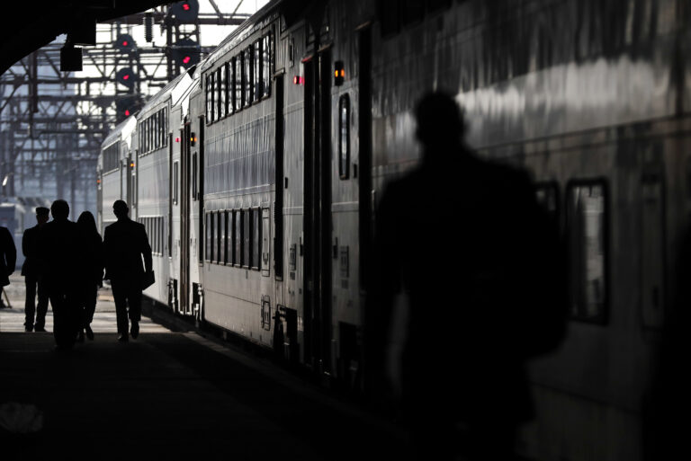 New Jersey Transit commuters walk along a platform to catch a train heading for Dover, N.J., Wednesday, April 5, 2017, in Hoboken, N.J. The heads of the two major commuter rail lines that use New York's Penn Station took turns criticizing Amtrak on Wednesday for two recent derailments that continued to cause headaches for commuters in the nation's busiest rail hub. (AP Photo/Julie Jacobson) (AP)