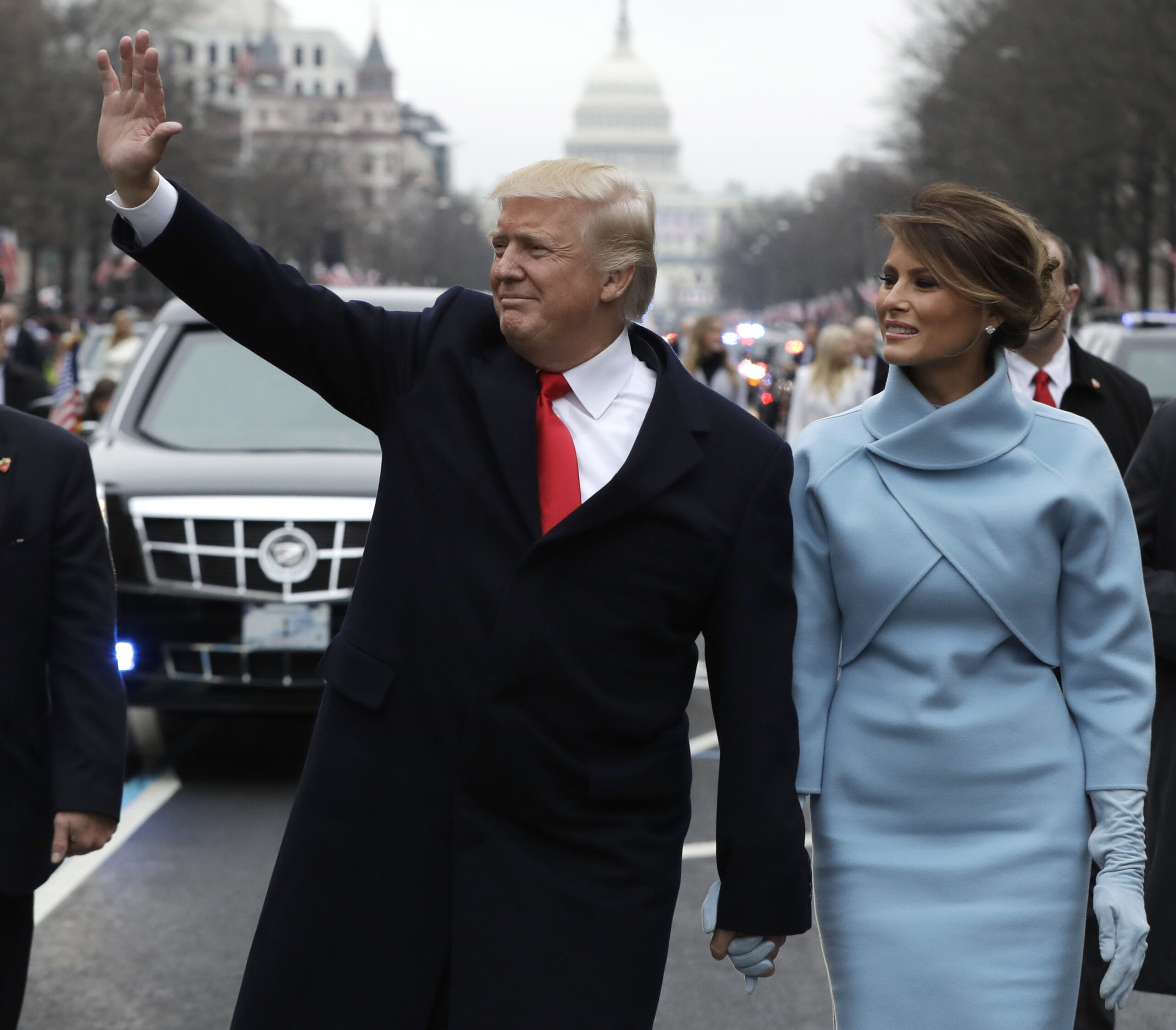 FILE- In this Jan. 20, 2017, file photo, President Donald Trump waves as he walks with first lady Melania Trump during the inauguration parade on Pennsylvania Avenue in Washington. Trump raised $107 million for his inaugural festivities. Trump’s inaugural committee is due to file information about those donors with the Federal Election Commission and said it would do so on Tuesday, April 18. (AP Photo/Evan Vucci, Pool, File) (AP)