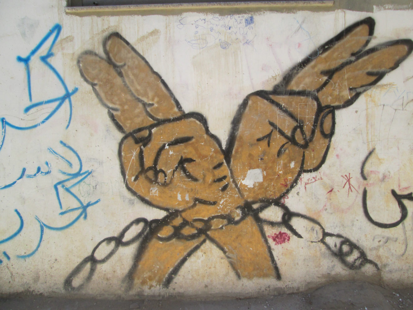 A mural painted on a wall in Al Am’ari Refugee Camp (Steven Davidson/Narratively)