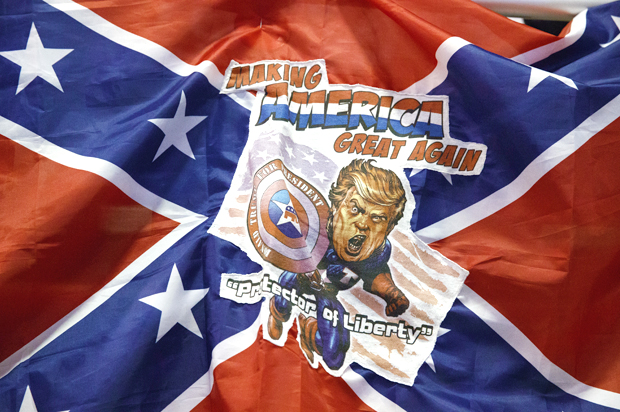 A Confederate flag with a depiction of Donald Trump (AP/Evan Vucci)