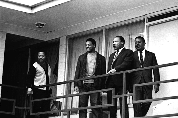 The Rev. Martin Luther King Jr. stands with other civil rights leaders on the balcony of the Lorraine Motel in Memphis, Tenn., on April 3, 1968, a day before he was assassinated. (AP)