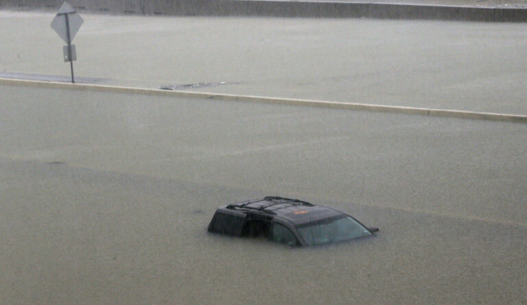 An abandoned vehicle sits in flood waters on the I-10 highway in Houston, Texas, Sunday, Aug. 27, 2017. (AP Photo/LM Otero)