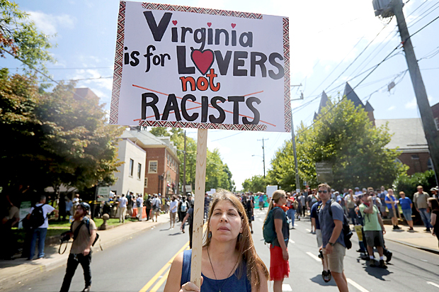 A counter-demonstrator marches down the street after the 'Unite the Right' rally was declared an unlawful gathering. (Getty/Chip Somodevilla)