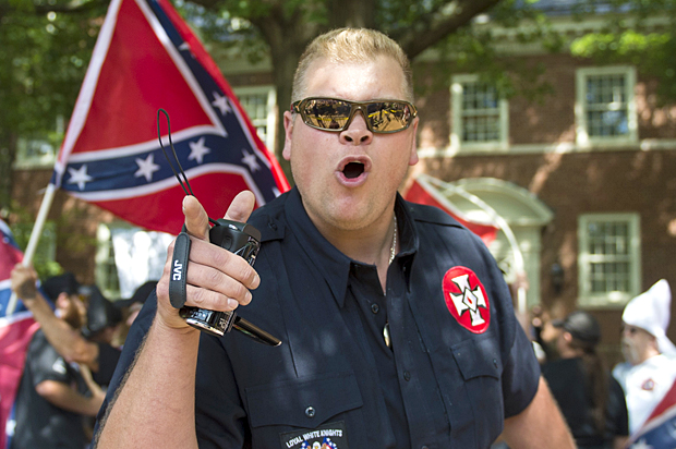 A member of the Ku Klux Klan shouts at counter protesters during a rally, calling for the protection of Southern Confederate monuments, in Charlottesville, VA (Getty/Andrew Caballero)