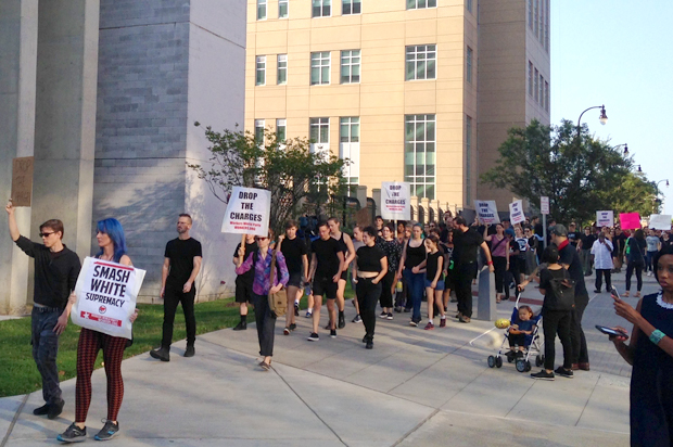 People march outside the courthouse in Durham, N.C, to show support for those arrested and charged with toppling a Confederate statue. (AP/Jonathan Drew)