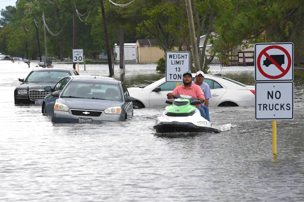 Local residents wade through flooded streets after Hurricane Harvey (Getty/Mark Ralston)