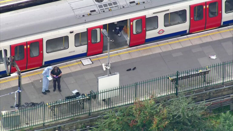 In this aerial image made from video, forensic officers work at the Parsons Green Underground Station after an explosion in London Friday, Sept. 15, 2017. A reported explosion at a train station sent commuters stampeding in panic, injuring several people at the height of London's morning rush hour, and police said they were investigating it as a terrorist attack. (Pool via AP)