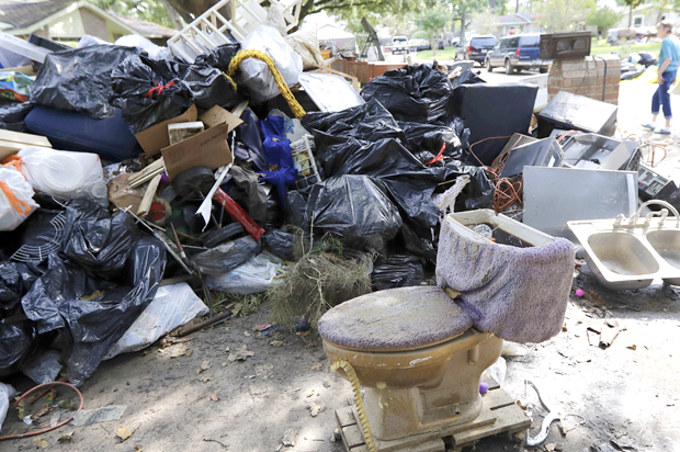 Pile of debris removed from a home that was damaged by Hurricane Harvey floodwaters (AP/David J. Phillip)