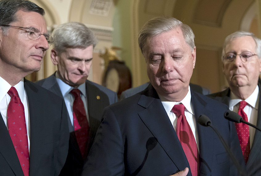 John Barrasso, Bill Cassidy, Lindsey Graham and Mitch McConnell discussing  Graham-Cassidy bill defeat (AP/J. Scott Applewhite)