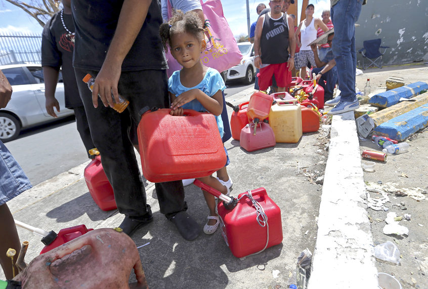 People wait in line to get fuel from a gas station after Hurricane Maria, in San Juan, Puerto Rico (AP/Gerald Herbert)