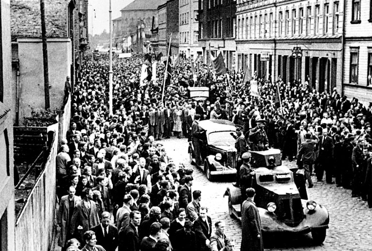 People line up to welcome the Soviet Red Army (Associated Press)