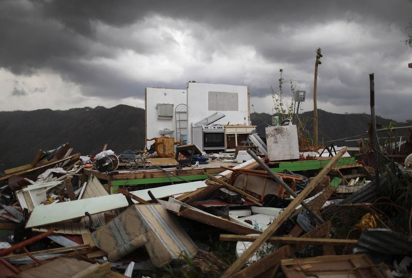 The remnants of a destroyed home stand more than two weeks after Hurricane Maria hit the island on October 6, 2017. (Getty/Mario Tama)