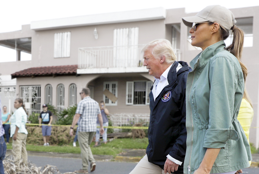Donald and Melania Trump take a walking tour to survey hurricane damage and recovery efforts in Puerto Rico. (AP/Evan Vucci)