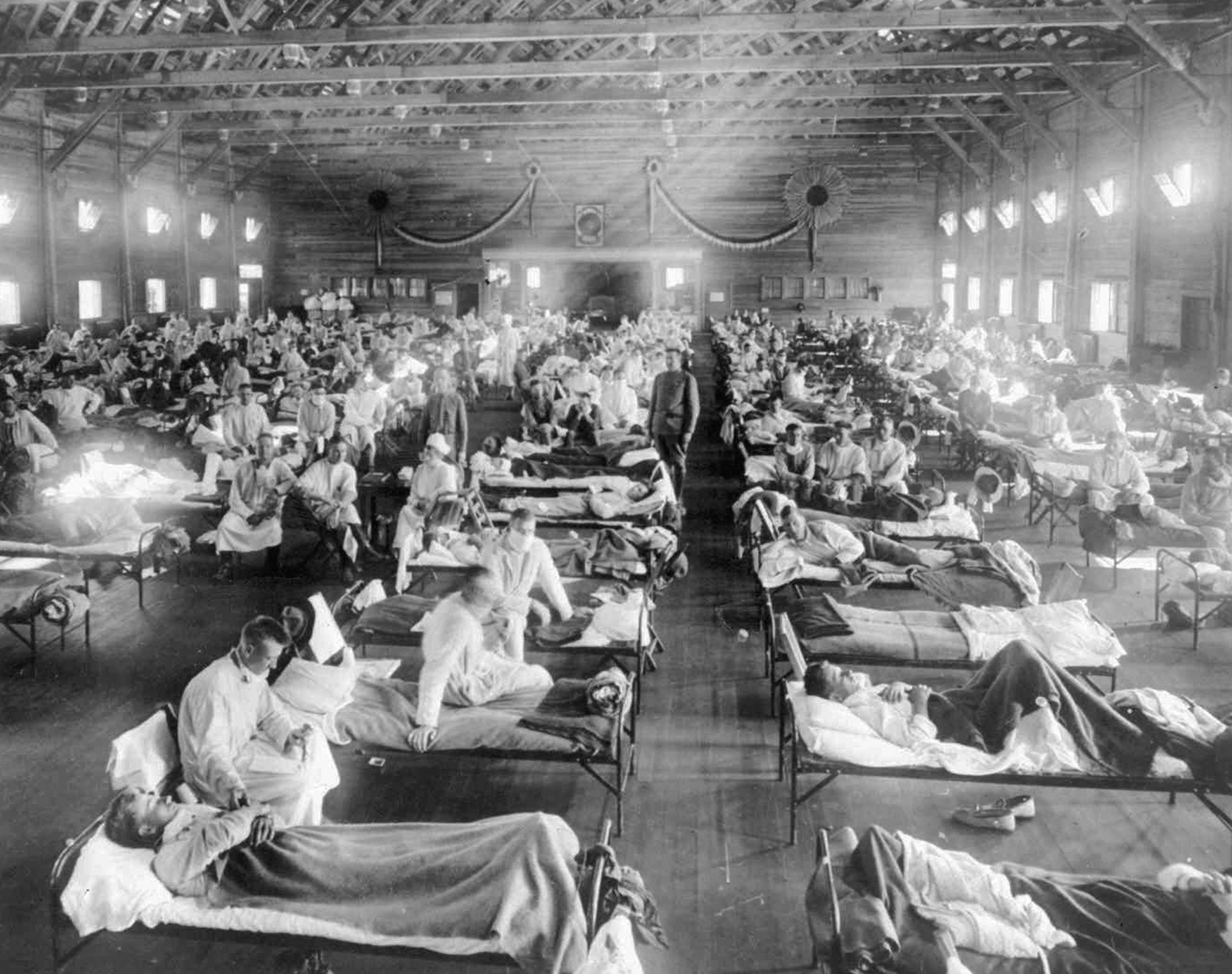 In this 1918 photograph provided by the National Museum of Heath, influenza victims crowd into an emergency hospital at Camp Funston, a subdivision of Fort Riley in Kansas. (AP Photo/National Museum of Health, File)