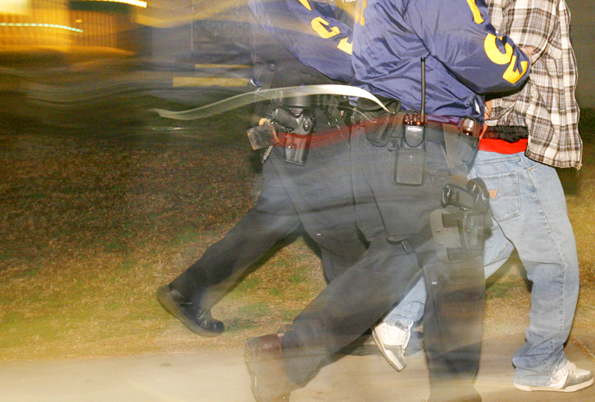 Immigration and Customs Enforcement (ICE) officers arrest a suspect (AP/Mark Avery)