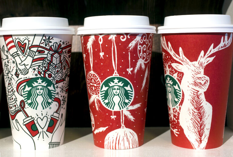 Three Starbucks holiday cups for the 2017 season are displayed. (AP/Mark Lennihan)