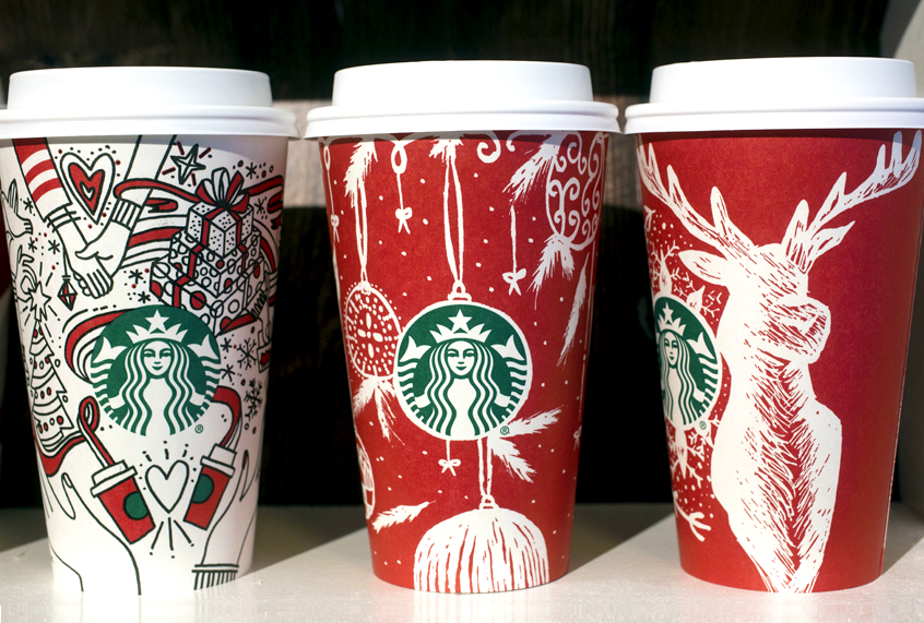 Three Starbucks holiday cups for the 2017 season are displayed. (AP/Mark Lennihan)