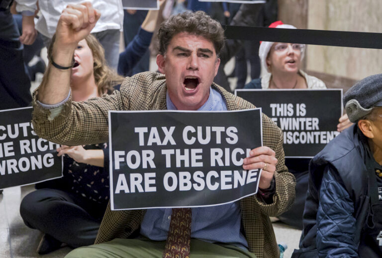 Protesters are seen outside the Senate Budget Committee hearing room. (AP/J. Scott Applewhite)