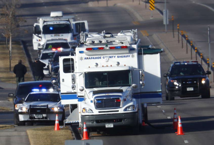 An investigator heads to the scene of a shooting, Dec. 31, 2017, in Highlands Ranch, Colo. (AP/David Zalubowski)