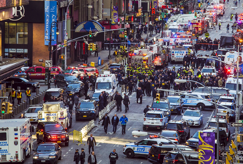 Law enforcement officials work following an explosion near New York's Times Square on Monday, Dec. 11, 2017 (AP/Andres Kudacki)