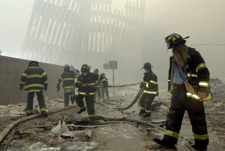 Firefighters work after the terrorist attack on the twin towers of lower Manhattan Tuesday, Sept. 11, 2001 (AP/Mark Lennihan)