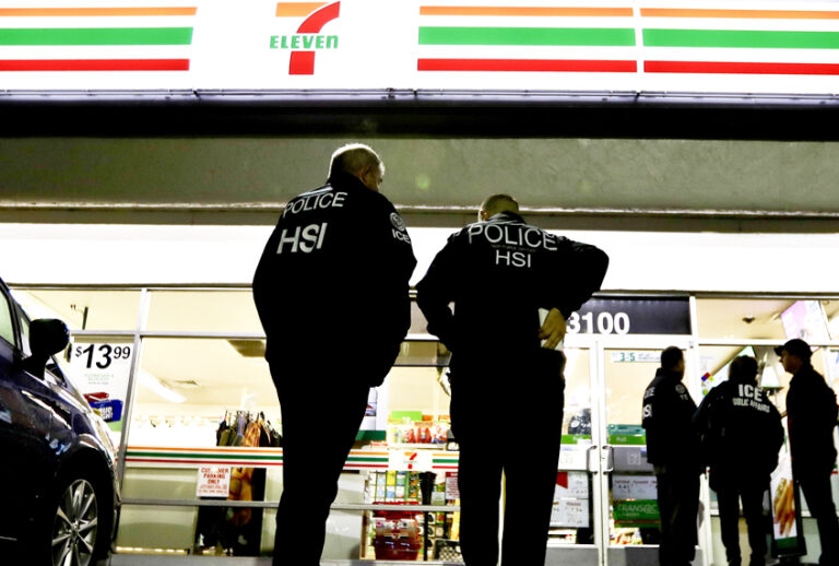 U.S. Immigration and Customs Enforcement agents serve an employment audit notice at a 7-Eleven store Jan. 10, 2018, in Los Angeles. (AP/Chris Carlson)