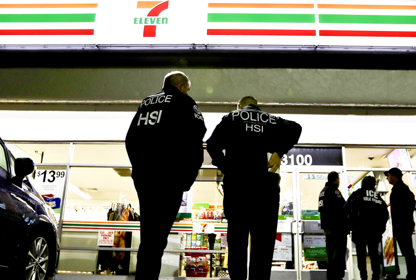 U.S. Immigration and Customs Enforcement agents serve an employment audit notice at a 7-Eleven store Jan. 10, 2018, in Los Angeles. (AP/Chris Carlson)
