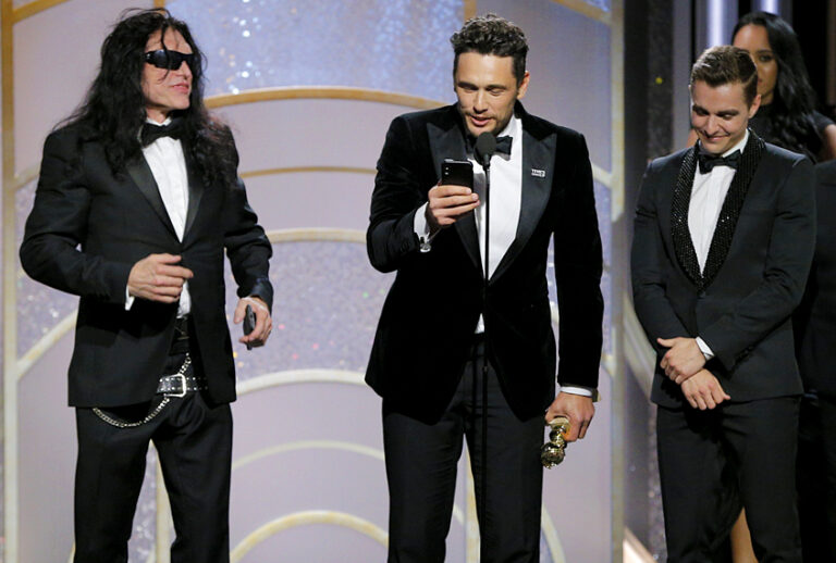 James Franco, with Tommy Wiseau and Dave Franco,  accepts the award for Best Performance by an Actor in a Motion Picture – Musical or Comedy for  “The Disaster Artist” during the 75th Annual Golden Globe Awards January 7, 2018 (Getty/Paul Drinkwater)