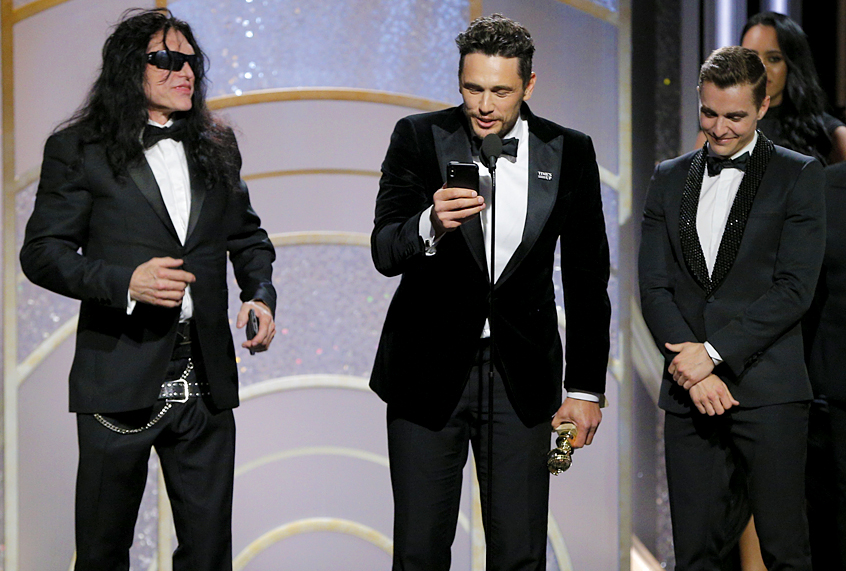 James Franco, with Tommy Wiseau and Dave Franco,  accepts the award for Best Performance by an Actor in a Motion Picture – Musical or Comedy for  “The Disaster Artist” during the 75th Annual Golden Globe Awards January 7, 2018 (Getty/Paul Drinkwater)