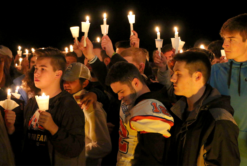 People attend a vigil for the victims of a fatal shooting at Marshall County High School, Jan. 25, 2018 (AP/Robert Ray)