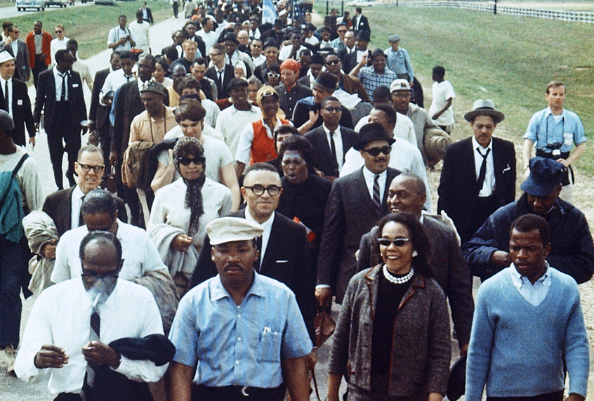 Martin Luther King Jr., flanked by his wife Coretta and John Lewis, leads a march from Selma to Montgomery, Alabama (AP)