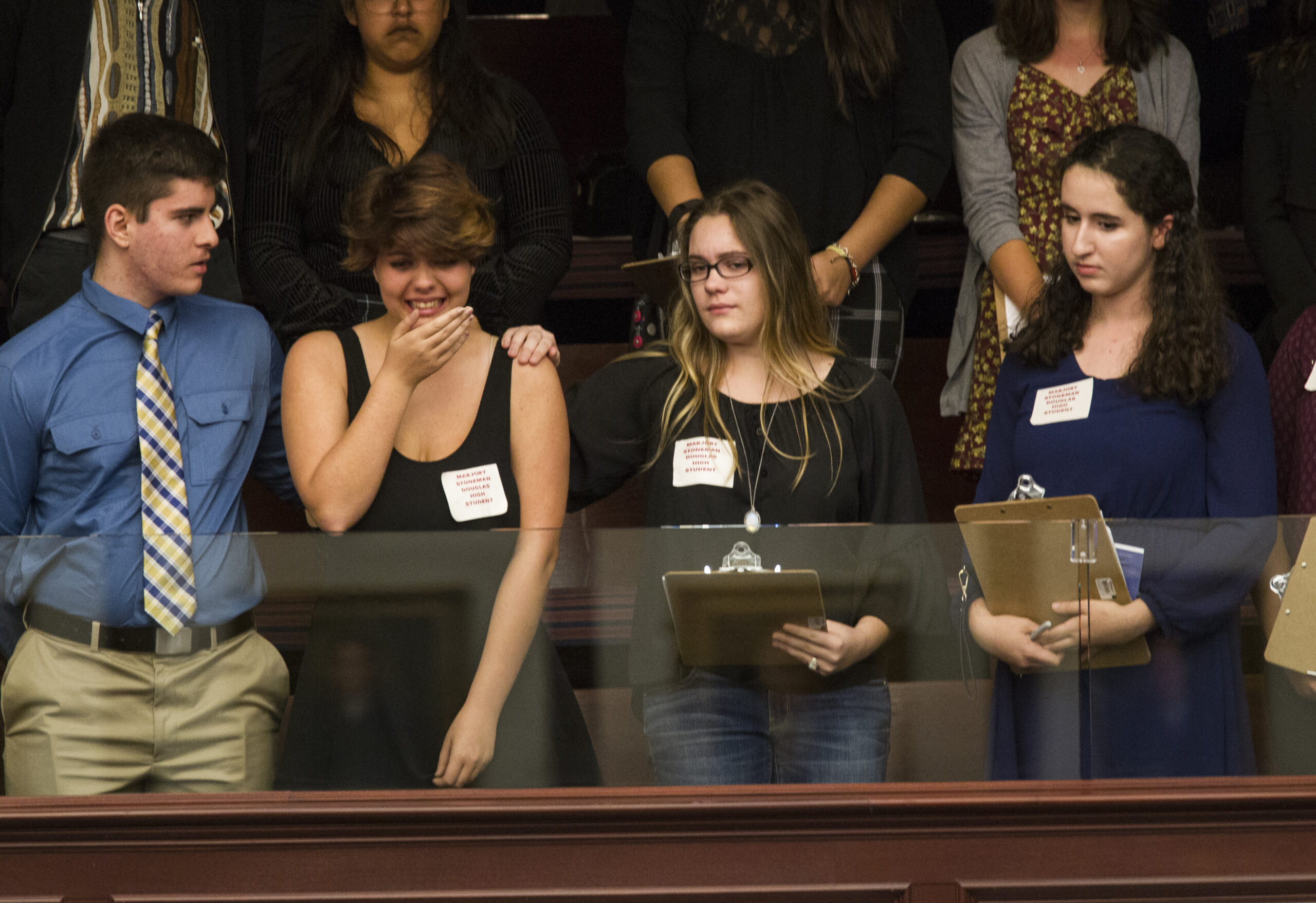 Sheryl Acquarola, a 16 year-old junior from Marjory Stoneman Douglas High School is overcome with emotion in the east gallery of the House of Representatives after the representatives voted not to hear the bill banning assault rifles and large capacity magazines at the Florida Capital in Tallahassee, Fla., Tuesday, Feb 20, 2018. (AP Photo/Mark Wallheiser)