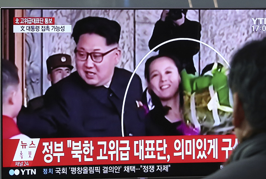 People watch a TV screen showing Kim Jong Un and his sister Kim Yo Jong (AP/Ahn Young-joon)