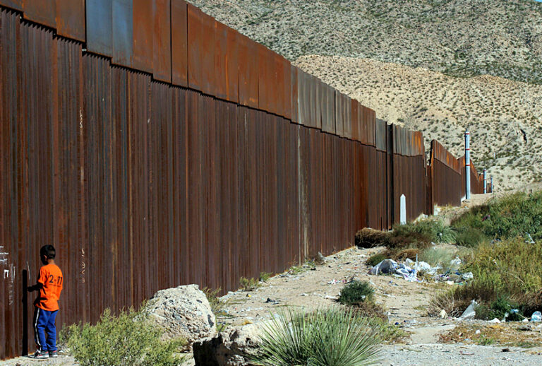 A child standing at the border wall observes the "Not Walls" demonstration by activists in the US in front of the wall that divides Ciudad Juarez, Mexico, from Sunland Park, New Mexico, on October 23, 2017. / AFP PHOTO / HERIKA MARTINEZ        (Photo credit should read HERIKA MARTINEZ/AFP/Getty Images) (Getty/Herika Martinez)