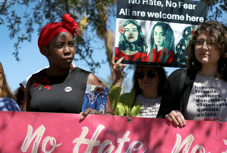 Women protest on International Women's Day in front of the U.S. Department of Homeland Security Immigration and Immigration and Customs Enforcement (ICE) office. (Getty/Joe Raedle)