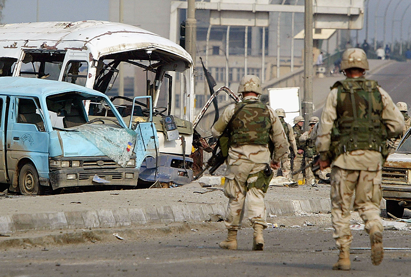 US Army soldiers investigate the site of an explosion, January 18, 2004 in Baghdad, Iraq (Getty/Mario Tama)