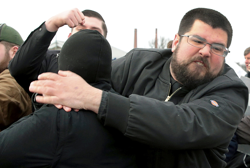 White nationalist Matthew Heimbach fights with demonstrators at Michigan State University as he and other alt-right advocates try to attend a speech by white nationalist Richard Spencer, March 5, 2018. (Getty/Scott Olson)