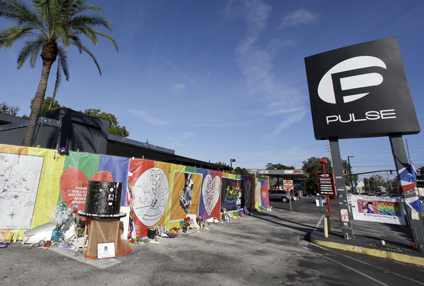 Artwork and signatures cover a fence around the Pulse nightclub (AP/John Raoux)