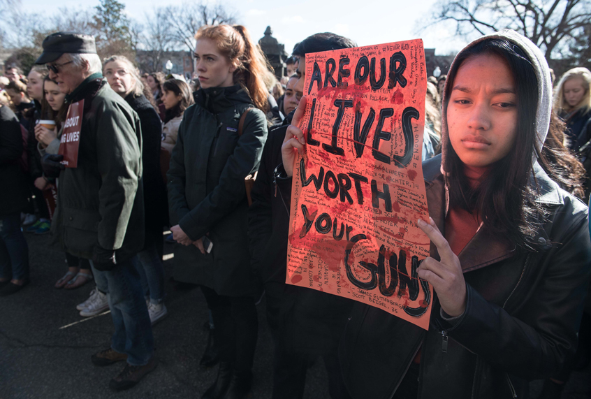 A student holds a sign at Georgetown University on March 14, 2018 during a national walkout to protest gun violence, one month after the school shooting in Parkland, Florida. (Getty Images)